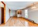 Hardwood floors enhance this living room with a partial view of the staircase at 17882 E Wyoming Pl, Aurora, CO 80017