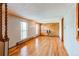 Bright living room with hardwood floors and natural light from large windows at 17882 E Wyoming Pl, Aurora, CO 80017