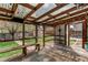 Covered patio with bench seating overlooking the fenced backyard at 17882 E Wyoming Pl, Aurora, CO 80017