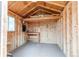 Interior view of a shed with wooden walls, workbench and window at 17882 E Wyoming Pl, Aurora, CO 80017