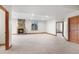 Spacious basement with a stone fireplace and multiple doorways at 3191 Bittersweet Ln, Evergreen, CO 80439