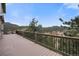 A spacious outdoor deck with stunning mountain views in the background at 3191 Bittersweet Ln, Evergreen, CO 80439