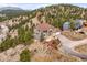 Beautifully landscaped two-story home with a driveway and stunning mountain views at 3191 Bittersweet Ln, Evergreen, CO 80439