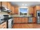 Well-equipped kitchen featuring stainless steel appliances and a scenic window overlooking mountain views at 3191 Bittersweet Ln, Evergreen, CO 80439