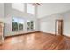 Spacious living room with beautiful hardwood floors, fireplace, and an abundance of natural light at 3191 Bittersweet Ln, Evergreen, CO 80439