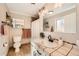 Bathroom featuring tiled countertops, updated fixtures, and a decorative mirror at 1801 S Meade St, Denver, CO 80219