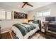 Well-lit bedroom with a cozy bed, hardwood floors and unique decor at 1801 S Meade St, Denver, CO 80219