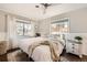 Bright bedroom featuring a cozy bed, decorative accents, and natural light at 1801 S Meade St, Denver, CO 80219