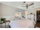 Comfortable bedroom with a ceiling fan and hardwood flooring at 1801 S Meade St, Denver, CO 80219