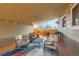 Inviting covered deck featuring outdoor seating, a grill, and stylish decor, perfect for entertaining at 1801 S Meade St, Denver, CO 80219