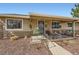 Charming home featuring a welcoming front entrance with a cozy porch and decorative iron railings at 1801 S Meade St, Denver, CO 80219