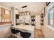 Modern kitchen with a quartz island, stainless steel appliances, and a convenient stackable washer/dryer at 1801 S Meade St, Denver, CO 80219