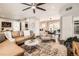 Open-concept living room flowing into the dining area, featuring a leather sectional and stylish decor at 1801 S Meade St, Denver, CO 80219