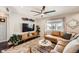 Bright living room with large window, modern furniture, and hardwood floors at 1801 S Meade St, Denver, CO 80219