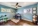 Bright office space features hardwood floors, dual windows, and a contemporary desk at 1801 S Meade St, Denver, CO 80219
