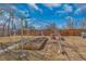 Backyard featuring a greenhouse for gardening enthusiasts, with ample space for planting at 1177 Jamaica St, Aurora, CO 80010