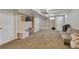 Spacious finished basement with cozy carpet and neutral walls, ready for personalization at 1177 Jamaica St, Aurora, CO 80010
