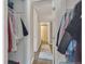 Hallway featuring neutral colors and closet access at 1177 Jamaica St, Aurora, CO 80010