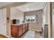 Functional laundry area featuring washer, dryer, and storage space at 1177 Jamaica St, Aurora, CO 80010