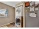 Laundry area featuring stacked washer and dryer next to gray refrigerator at 1177 Jamaica St, Aurora, CO 80010