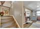 Open staircase leading to laundry and kitchen area at 1177 Jamaica St, Aurora, CO 80010