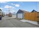 View of back alley featuring garages and fences, providing backyard access at 3317 W 37Th Ave, Denver, CO 80211