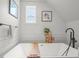 Bright bathroom with a modern tub, wood accents, and stylish decorative pieces at 3317 W 37Th Ave, Denver, CO 80211