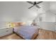 Airy bedroom featuring hardwood floors, a vaulted ceiling, and a comfortable king-size bed at 3317 W 37Th Ave, Denver, CO 80211