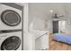 Bright bedroom featuring a ceiling fan, hardwood floors and convenient laundry closet at 3317 W 37Th Ave, Denver, CO 80211