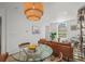 Bright dining area featuring modern lighting fixture and an open layout with comfortable seating at 3317 W 37Th Ave, Denver, CO 80211