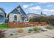 Beautiful home exterior with a new wooden fence and freshly landscaped front yard at 3317 W 37Th Ave, Denver, CO 80211