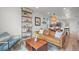 Stylish living room with modern furnishings, a large leather couch, and open-concept kitchen view at 3317 W 37Th Ave, Denver, CO 80211