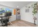 Bright office space featuring hardwood floors, a window view, and a built-in bookcase at 3317 W 37Th Ave, Denver, CO 80211
