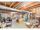 Unfinished basement with exposed wooden ceiling beams, ductwork, and concrete walls ready for customization at 5485 S Jasper Ct, Centennial, CO 80015