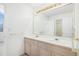 Bathroom with double sinks and a large mirror at 5485 S Jasper Ct, Centennial, CO 80015