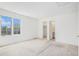 Bedroom with a view of the outdoors and closet at 5485 S Jasper Ct, Centennial, CO 80015