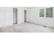 Bedroom with a large window and a closet at 5485 S Jasper Ct, Centennial, CO 80015