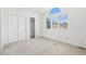 Bedroom featuring windows, closets, and bright light at 5485 S Jasper Ct, Centennial, CO 80015