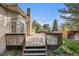 Large wooden deck with stairs provides backyard access, offering relaxing space for outdoor enjoyment at 5485 S Jasper Ct, Centennial, CO 80015