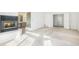 Spacious living room with fireplace feature, bathroom, and access to bedroom at 5485 S Jasper Ct, Centennial, CO 80015