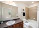 Well-lit bathroom with a single vanity and a shower-tub combo at 11213 Colony Cir, Broomfield, CO 80021