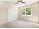 Neutral bedroom with carpet, a ceiling fan, and a window allowing natural light to enter at 11213 Colony Cir, Broomfield, CO 80021
