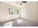 Cozy bedroom featuring two windows providing ample natural light and a ceiling fan at 11213 Colony Cir, Broomfield, CO 80021