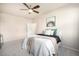 Comfortable bedroom featuring a ceiling fan, soft carpet, and stylish decorative touches at 11213 Colony Cir, Broomfield, CO 80021
