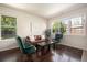 Cozy living room featuring large windows, hardwood floors, and modern decor with plenty of light at 11213 Colony Cir, Broomfield, CO 80021