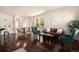 Open living space with hardwood floors, modern decor, and plenty of natural light from the large windows at 11213 Colony Cir, Broomfield, CO 80021