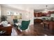 Bright open floor plan with wood floors, modern furnishings and plenty of natural light from large windows at 11213 Colony Cir, Broomfield, CO 80021