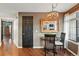 Cozy dining area with dark table and view of the living room in the mirror at 4878 E Kentucky Ave # B, Denver, CO 80246