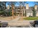 Attractive condo building showcasing manicured grounds, mature trees, and inviting walkways, creating a welcoming atmosphere at 4878 E Kentucky Ave # B, Denver, CO 80246