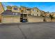 Townhome complex featuring multiple garages and units at 4878 E Kentucky Ave # B, Denver, CO 80246